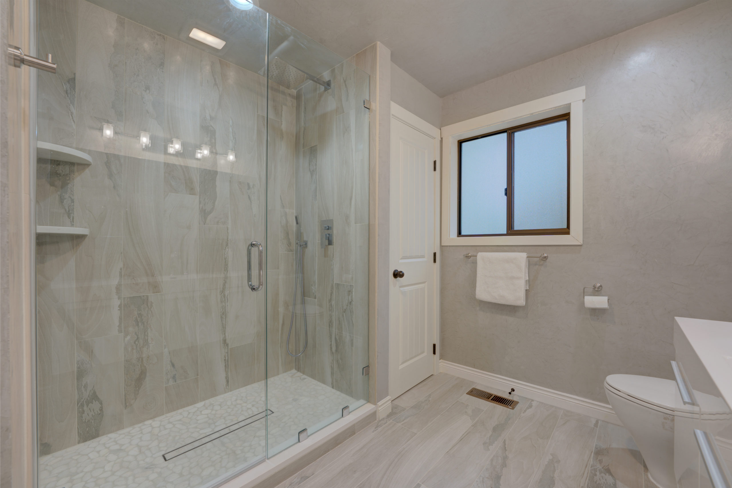 new bathroom remodel with a walk in shower